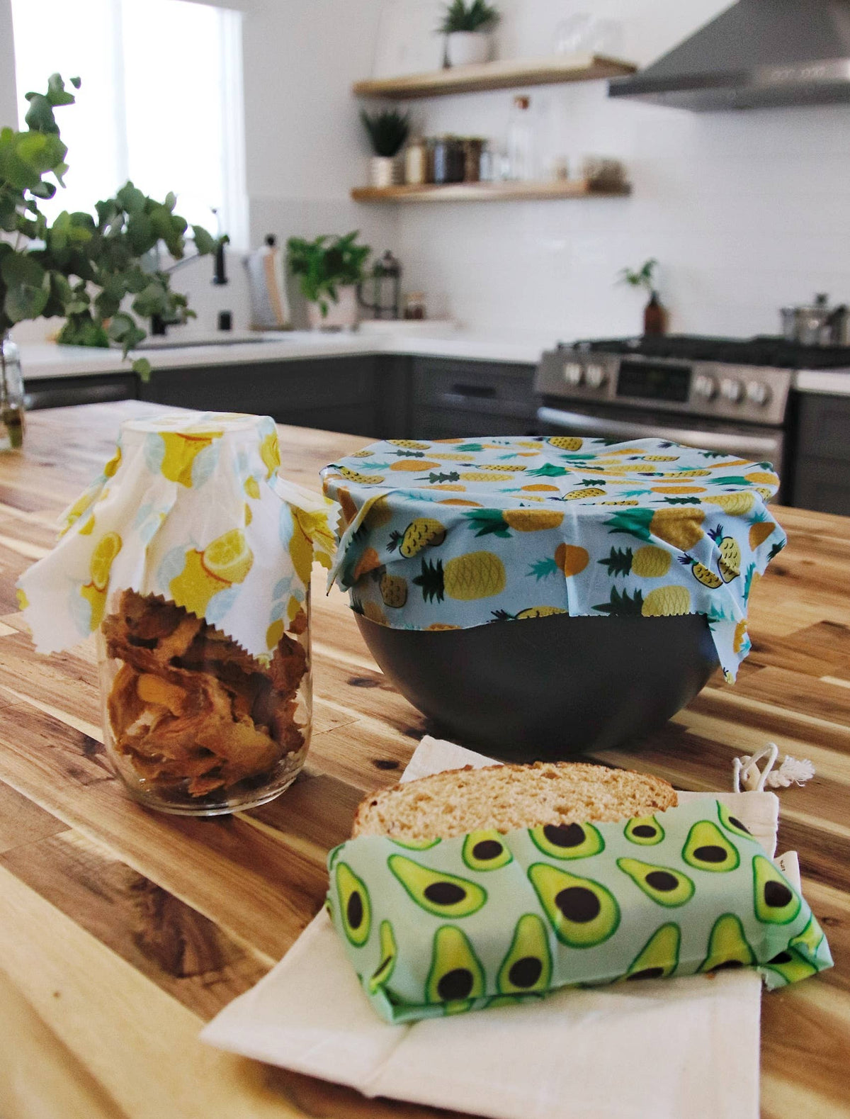 Vegan plant-based wax wraps by Me Mother Earth, eco-friendly reusable wraps with colorful patterns on fabric.
