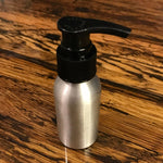 Aluminum bottles with lotion, soap, and fine mist spray pumps by OTB Refills, displayed with different pump attachments.