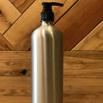 OTB Refills aluminum bottles with lotion, soap, and fine mist sprayers, showcasing sleek, reusable containers with pump dispensers.