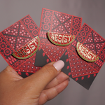 Resist Watermelon enamel pin by Stitch4pali featuring a colorful watermelon design on a metal pin backing.