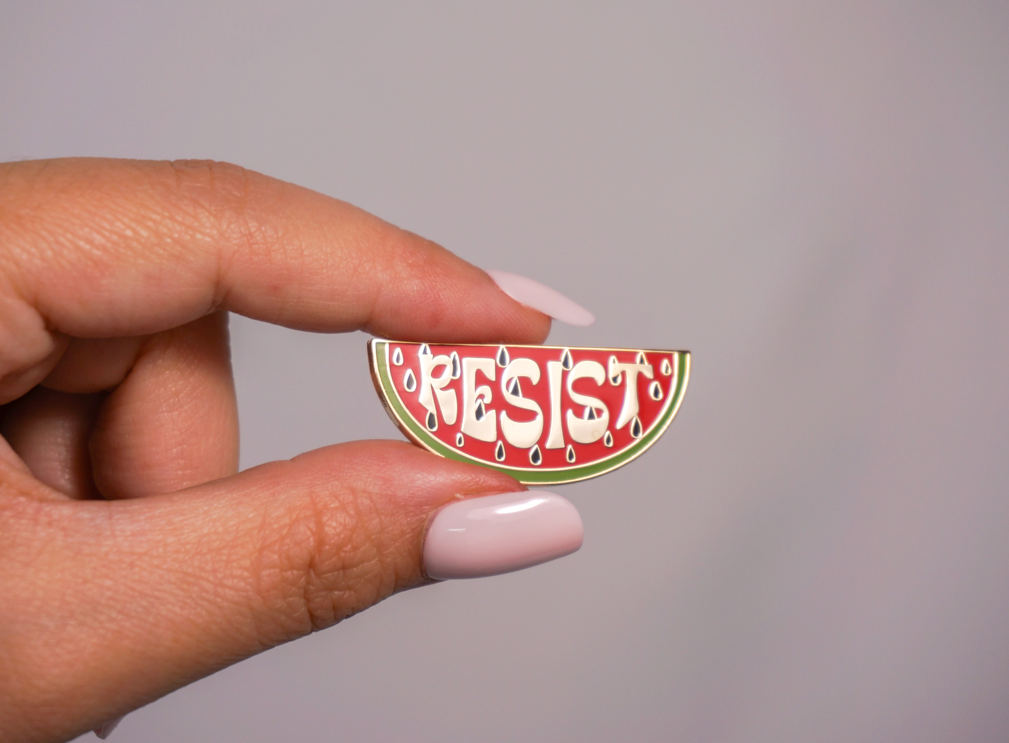 Resist Watermelon enamel pin by Stitch4pali featuring a colorful watermelon slice with "Resist" text, perfect for accessories.