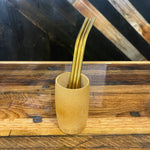 Assorted bent stainless steel straws by OTB Refills, showcasing shiny, reusable drinking straws on a white background.
