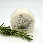 Rainwater Botanicals healing solid conditioner bar, zero waste hair care product with natural ingredients and eco-friendly design.