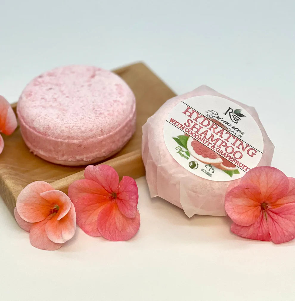 Hydrating Rainwater Botanicals solid shampoo bars with zero waste packaging, designed for gentle, eco-friendly hair cleansing.