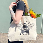 Counter Couture tote bag with stylish black and white geometric pattern, featuring two sturdy handles and spacious interior.
