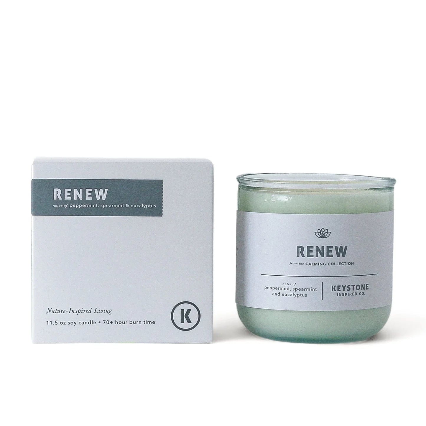 Keystone Inspired 11.5 oz soy candle in a clear glass container, showcasing a cozy, natural ambiance with a lit wick.