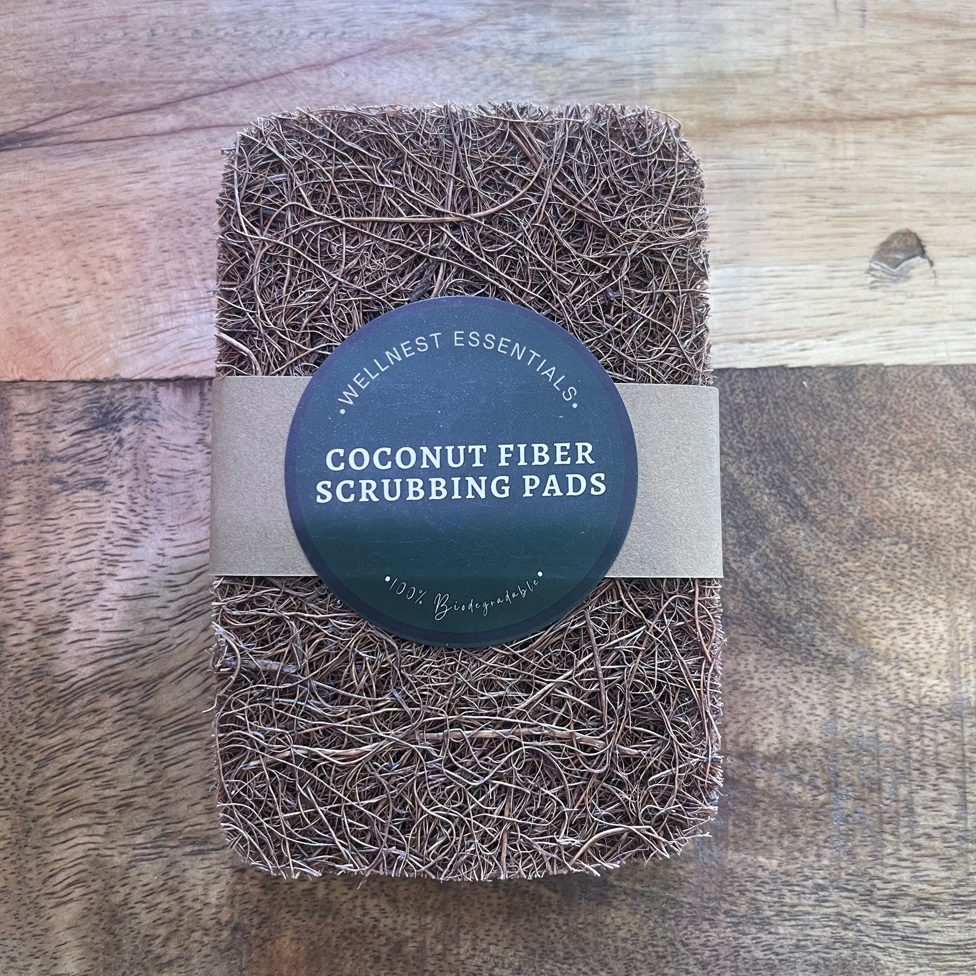 Five coconut fiber scrub pads from The Wellnest Shop, natural exfoliating cleaning sponges for kitchen and household use.