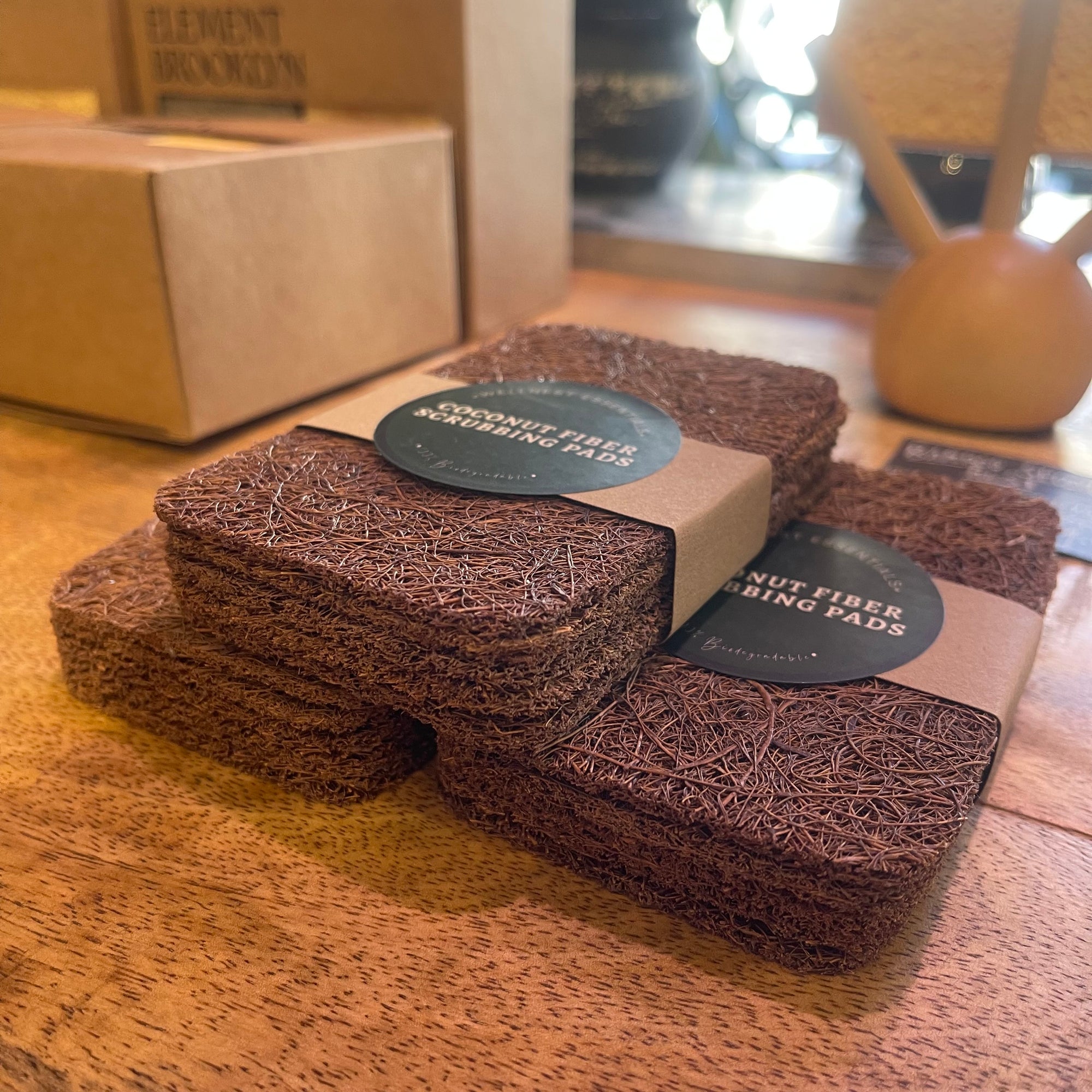 Set of five coconut fiber scrub pads from The Wellnest Shop, natural exfoliating cleaning tools for kitchen and bathroom use.