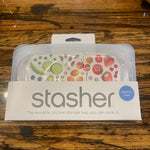 Stasher Snack Size reusable silicone storage bag with clear body and teal seal, ideal for snacks and small items.