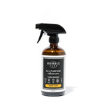 Humble Suds all-purpose cleaner in a 16oz glass spray bottle with a blue spray nozzle, ready for household cleaning.