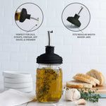 ReCap Mason jar pour spout lid attached to a glass jar, ideal for easy pouring and sealing of beverages or liquids.