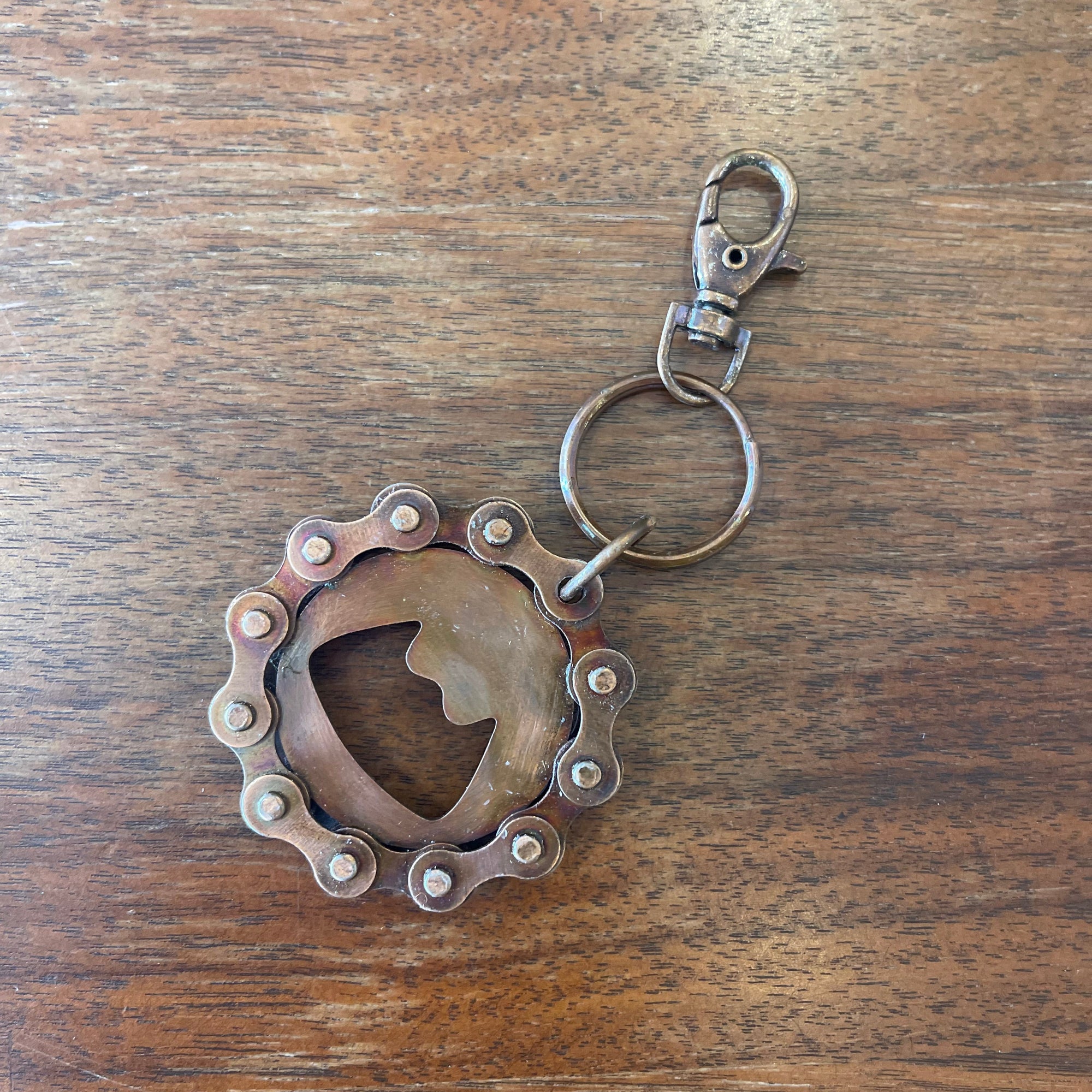 Off the Bottle Refill Shop Ten Thousand Villages bottle opener with a sleek metal design and ergonomic handle on a white background.