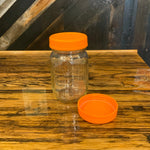 Assorted plastic Mason jar lids from OTB Refills, colorful and diverse, for sealing Mason jars and preserving foods.