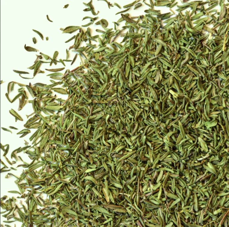 Fresh organic thyme sprigs from Essential Organics on a wooden surface, showcasing vibrant green herb leaves.