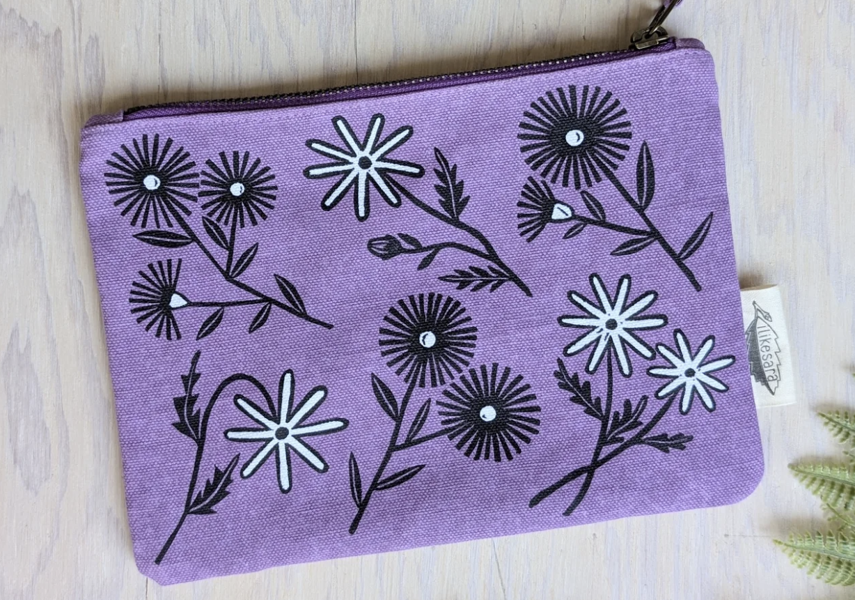 ilikesara zippered pouches shown in a screenshot, featuring colorful fabric designs and secure zipper closures.