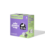 Four-pack of Who Gives a Crap bamboo toilet paper rolls, eco-friendly and 100% recycled or bamboo material, stacked neatly.