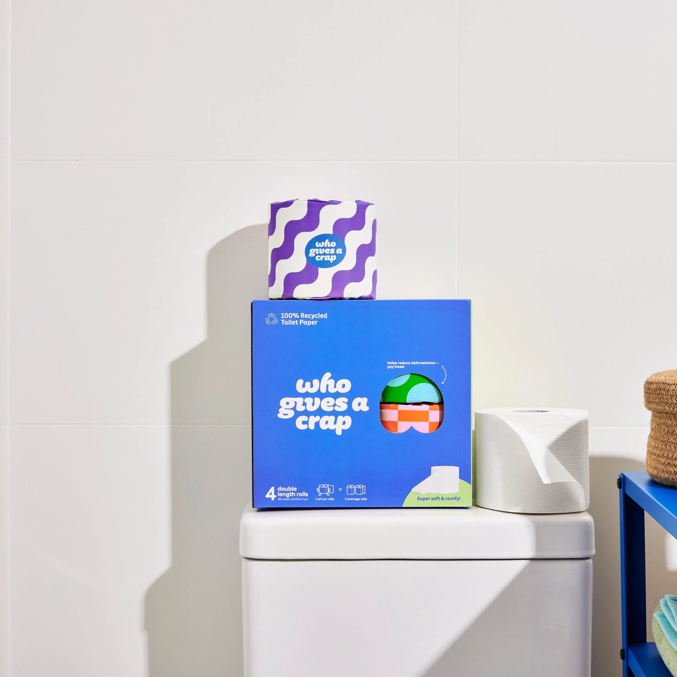 Four-pack of Who Gives a Crap toilet paper, eco-friendly 100% recycled or bamboo, showing soft, white toilet paper rolls.