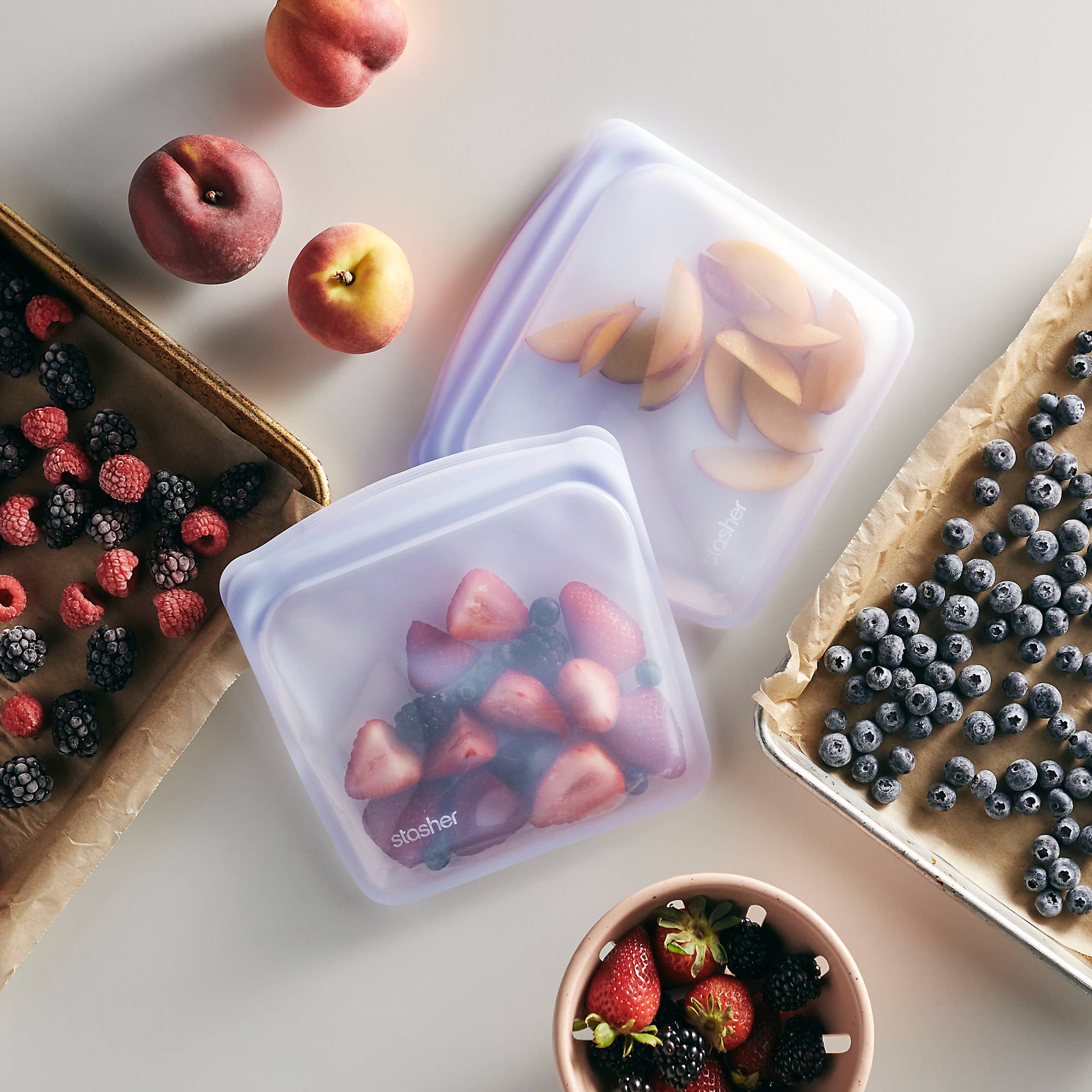 Reusable Stasher Sandwich Size silicone storage bag with clear, airtight design and zip closure for snacks and sandwiches.