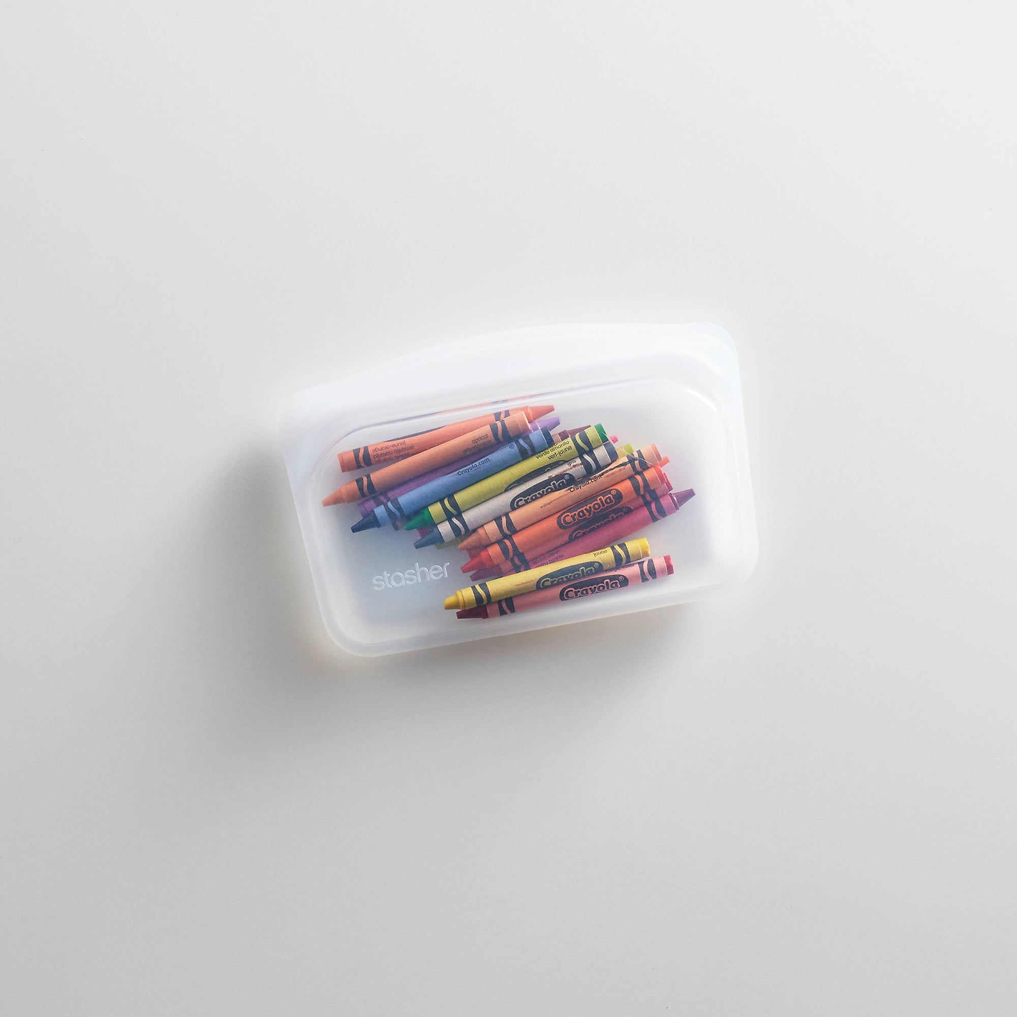 Stasher Snack Size reusable silicone storage bag with clear body and teal zipper for snacks or small food items.