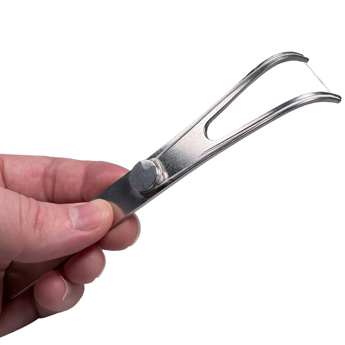 Refillable stainless steel flosser by Dental Lace with floss loaded, showcasing a sleek, durable dental hygiene tool.