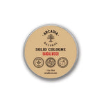 Natural Solid Scents perfume by Arcadia Naturals in a sleek metal tin, featuring a smooth, solid fragrance balm.