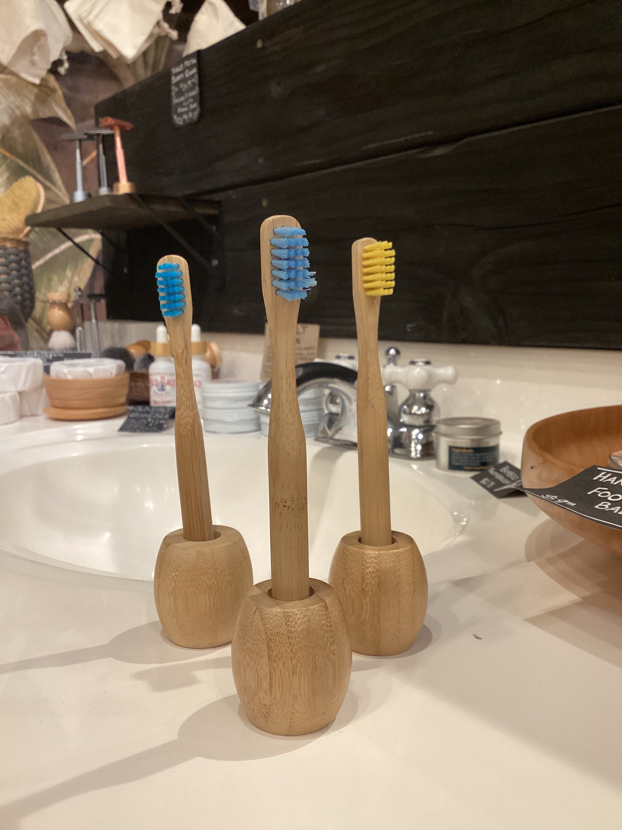 Kids bamboo toothbrush by OTB Refills with green bamboo handle and soft bristles, designed for gentle oral care.